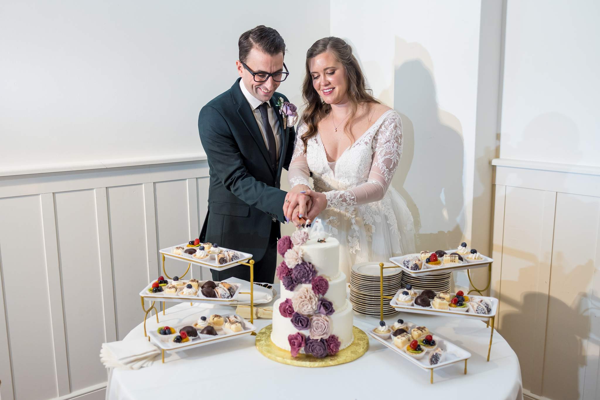 Couple cutting their wedding cake at 240 Glynn Street