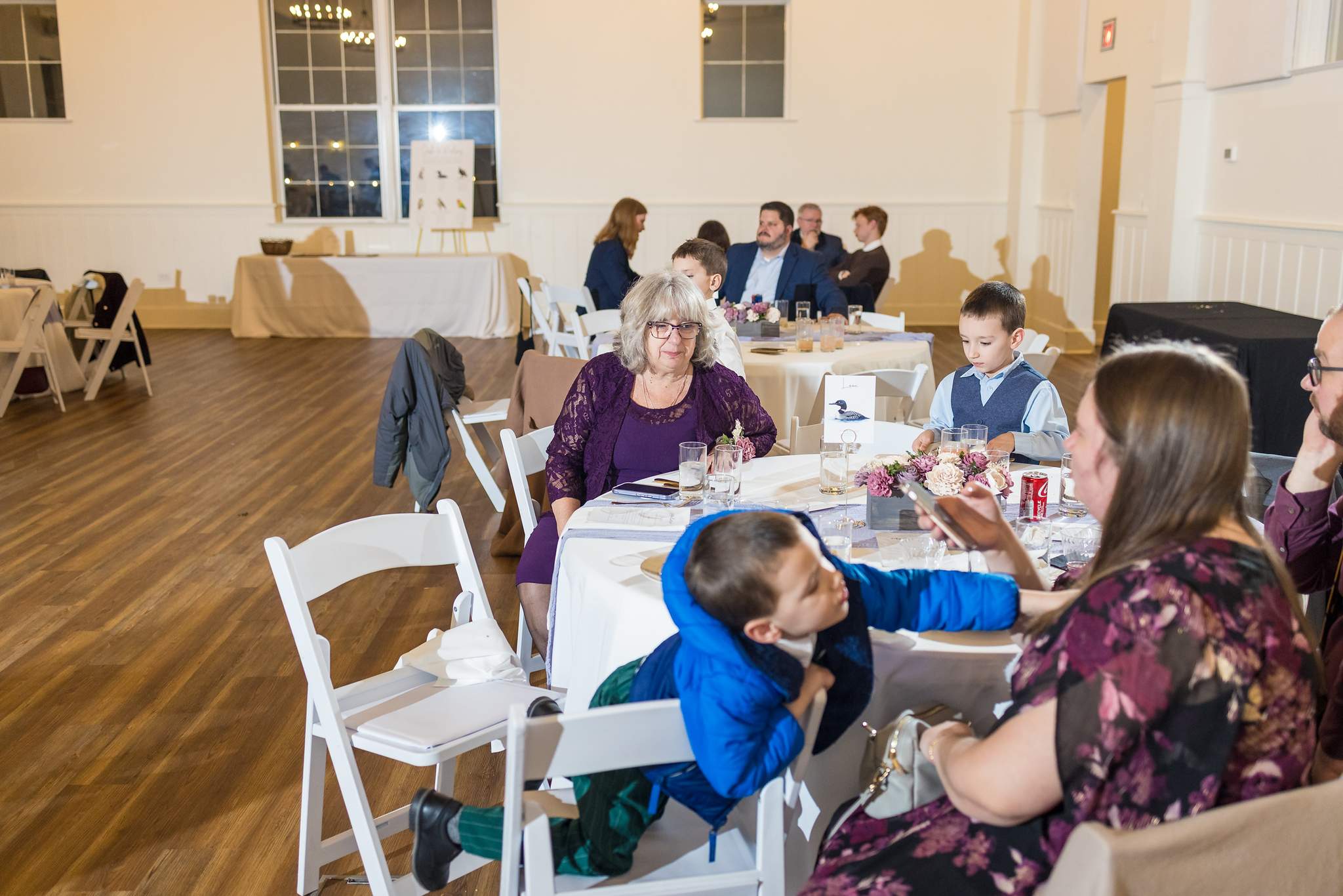 Guests at reception tables at 240 Glynn Street in Fayetteville