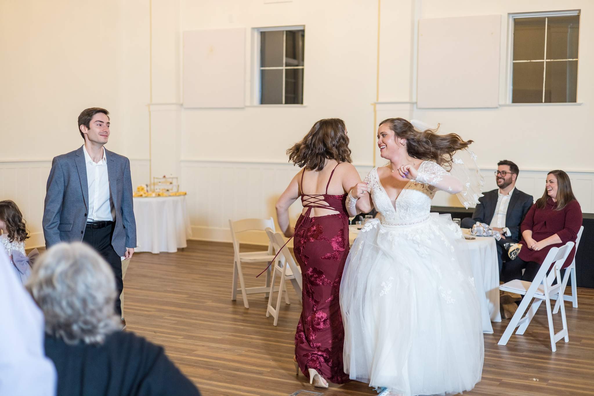 Bride dancing with a guest at 240 Glynn Street