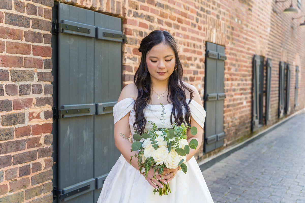 Bride holding wedding bouquet florals from Flowers From Us Florist photos