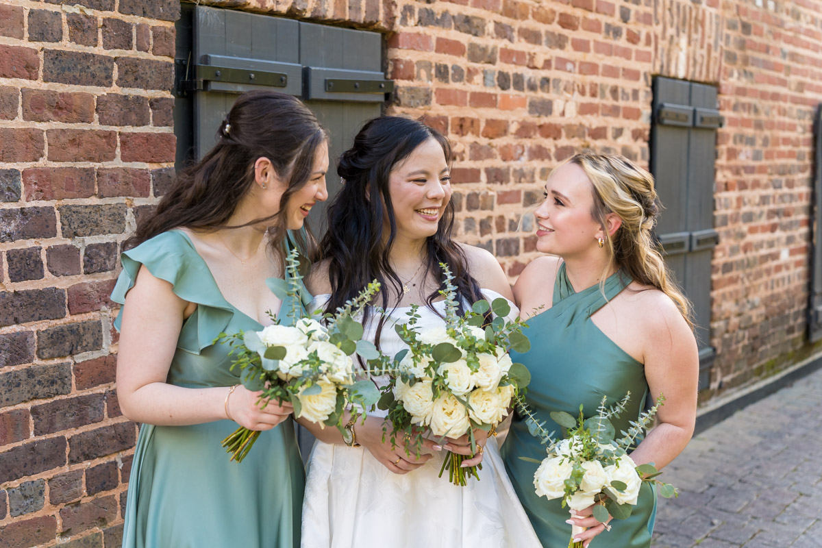Bride and bridesmaids holding wedding bouquets from Flowers From Us - Alpharetta Florist