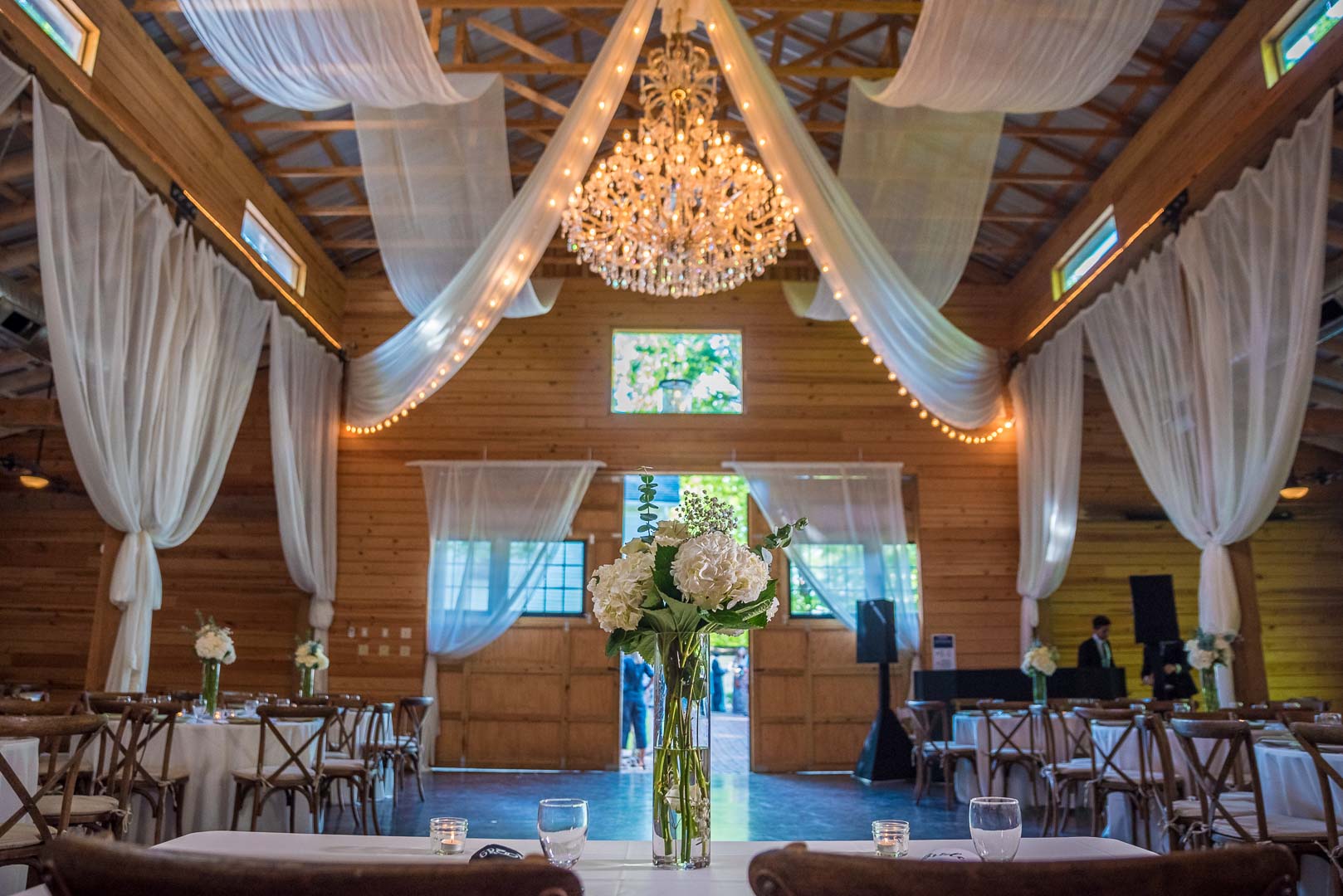 Decor inside the barn at the Wheeler House featuring crystal chandelier