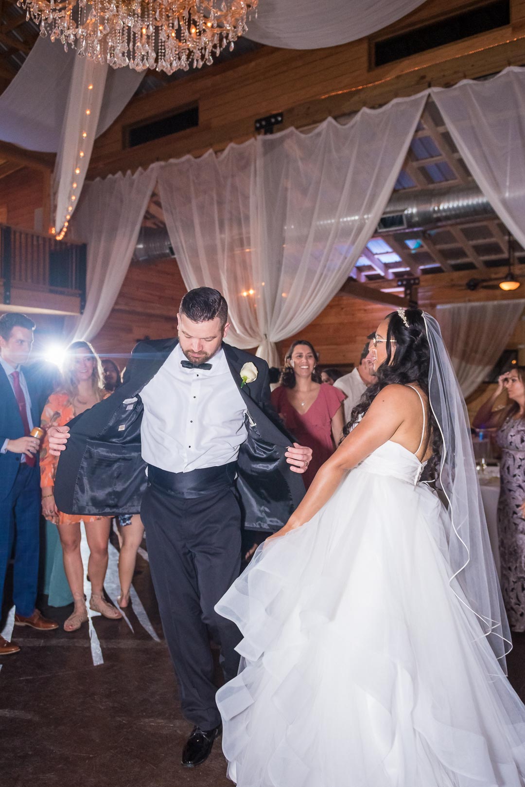 Bride and Groom dancing on the dance floor in barn reception at the Wheeler House