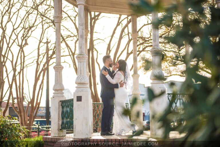 Couple embracing under the gazebo after a Marietta courthouse wedding