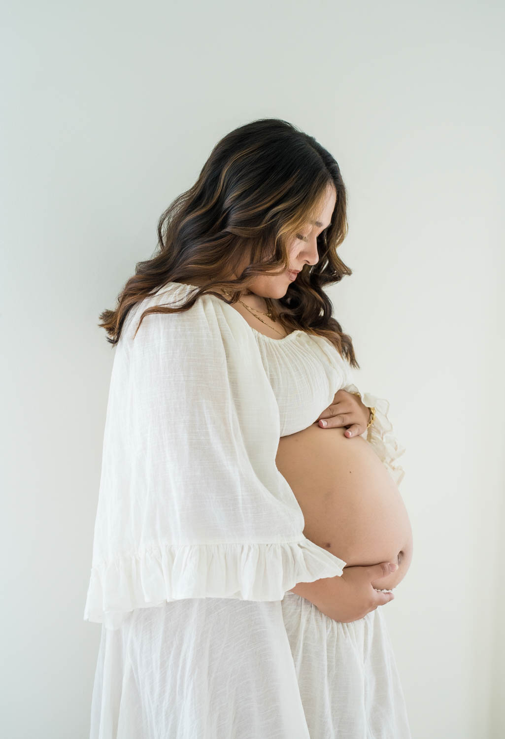 Maternity photo near the light and airy windows in the Nest Room in the Farmhouse at Prospect Farms