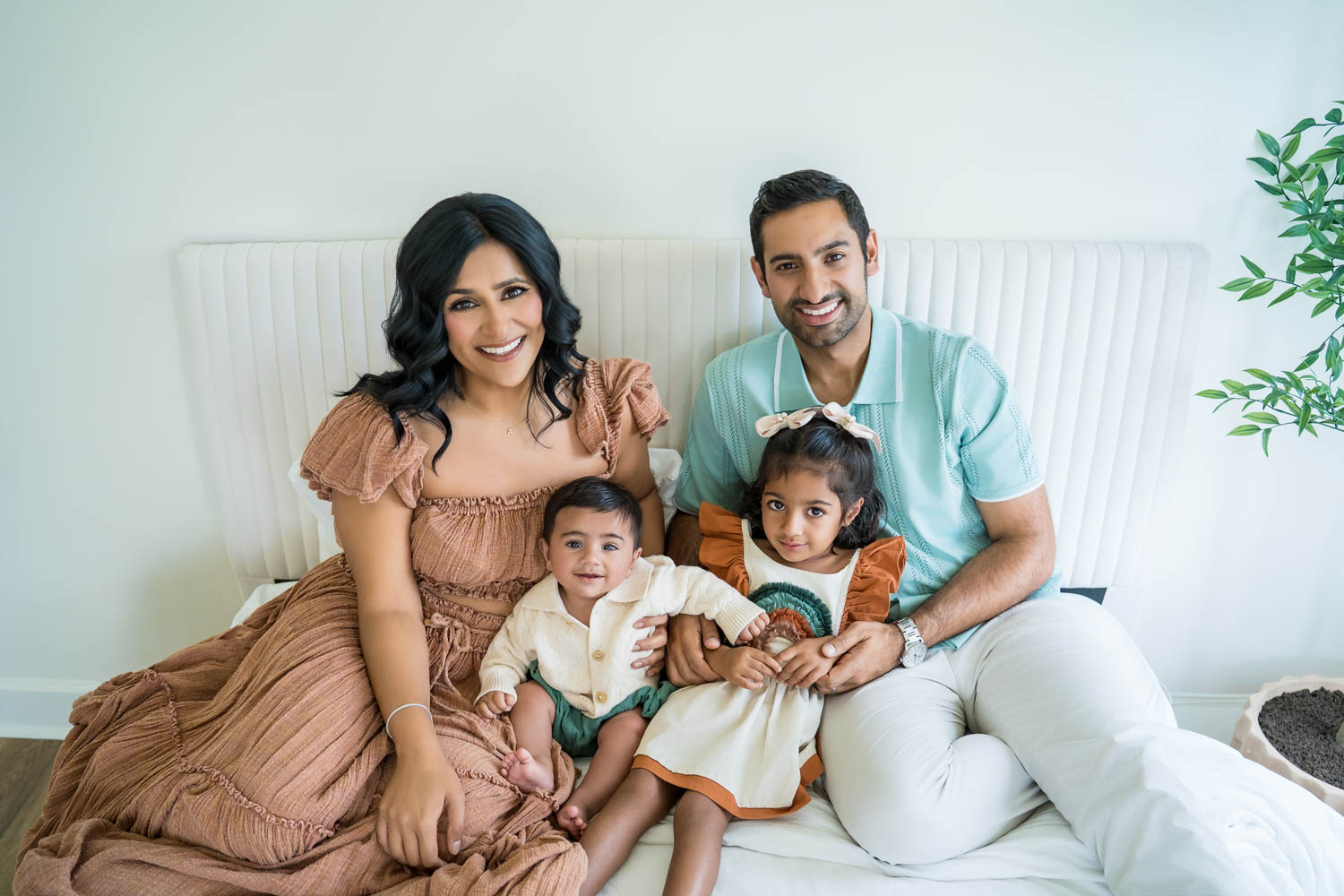 Indian family portrait on the bed in the Nest Room in the Farmhouse at Prospect Farms