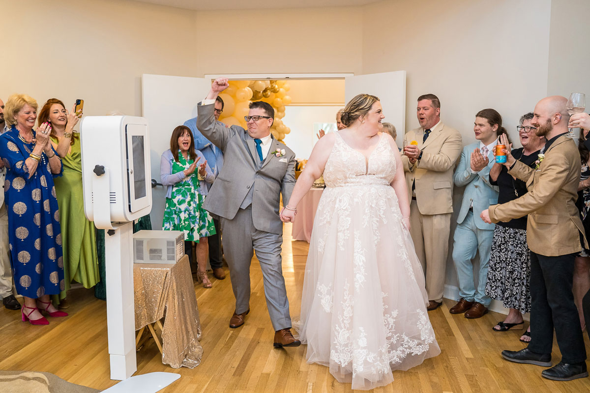 A couple walking into their wedding reception at The Solarium at Historic Scottish Rite in Decatur, GA in Atlanta.