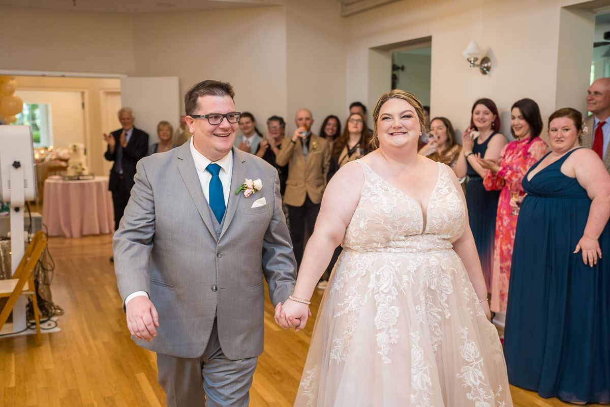 A couple walking into their wedding reception at The Solarium at Historic Scottish Rite in Decatur, GA in Atlanta.