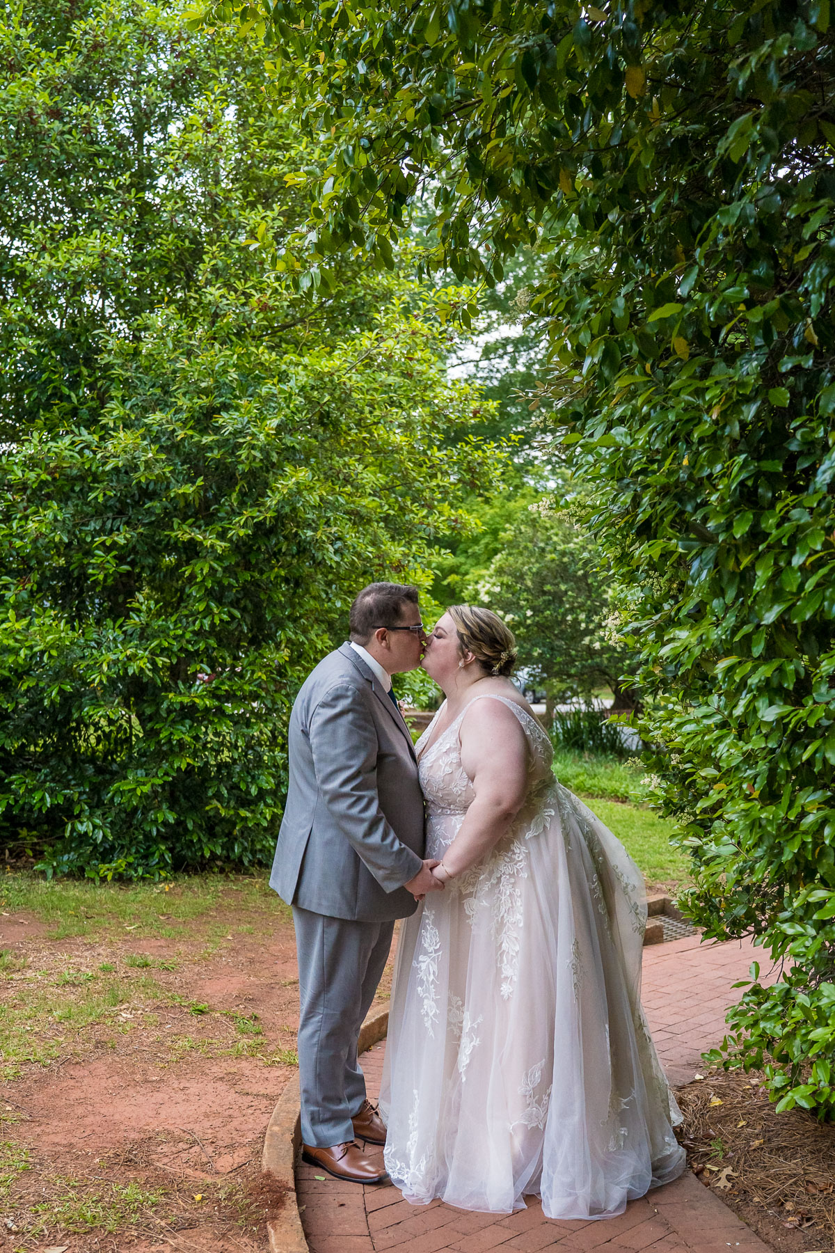 Outdoor green space photos of a couple on their wedding day at the Solarium at Historic Scottish Rite in Decatur (Atlanta)