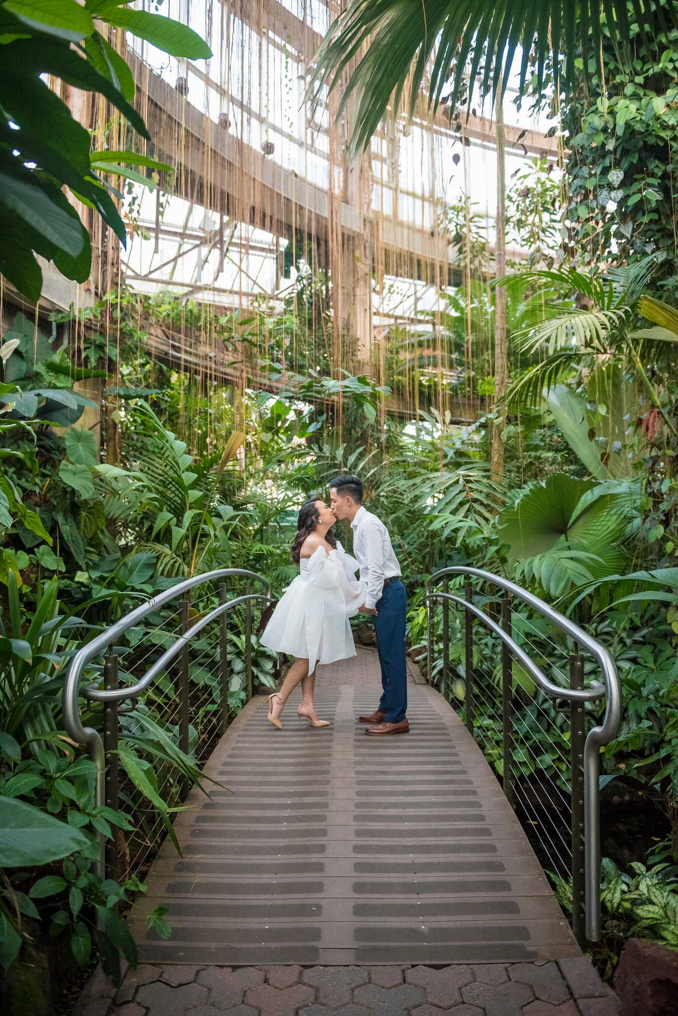Couple sharing a kiss on the conservatory canopy bridge