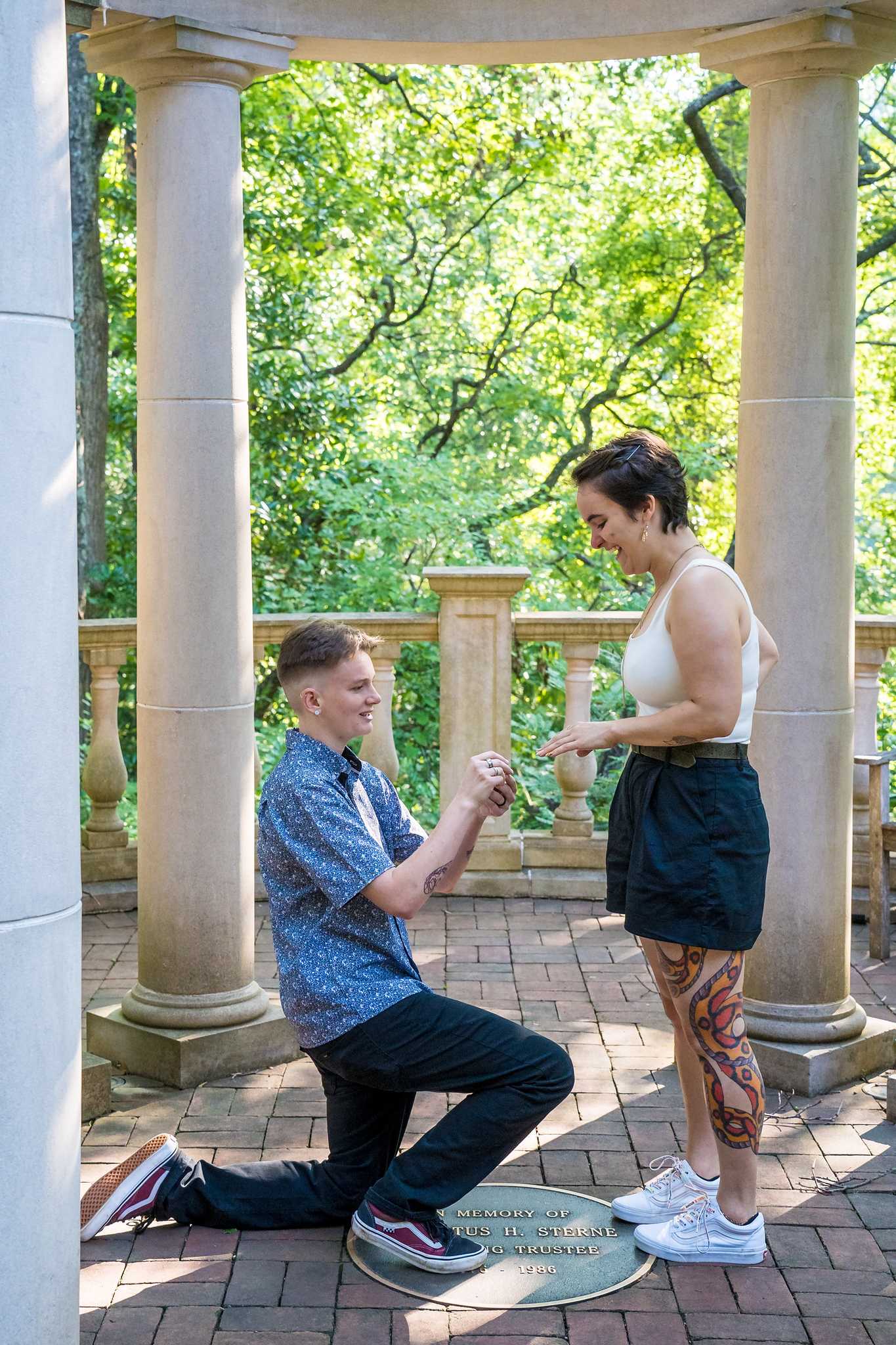 Ring slipped onto the finger during a proposal in the gazebo at the Atlanta Botanical Garden