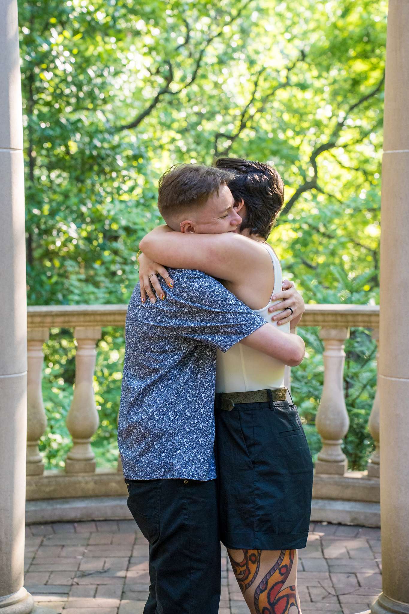 Big celebratory hug right after a yes at the Atlanta Botanical Garden