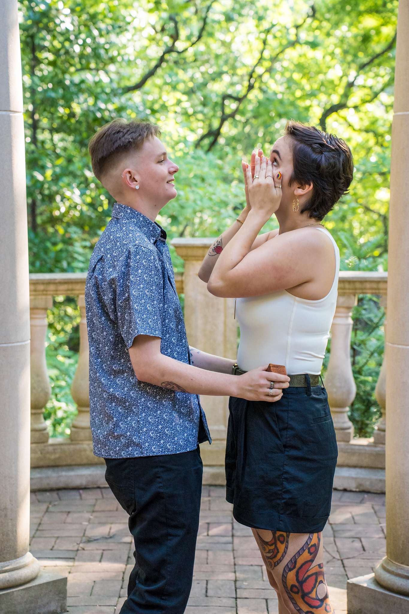 Admiring the new engagement ring together inside the Atlanta Botanical Garden gazebo