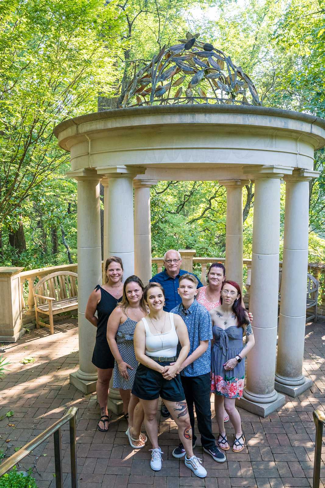 Group photo with loved ones in front of the domed gazebo after a proposal