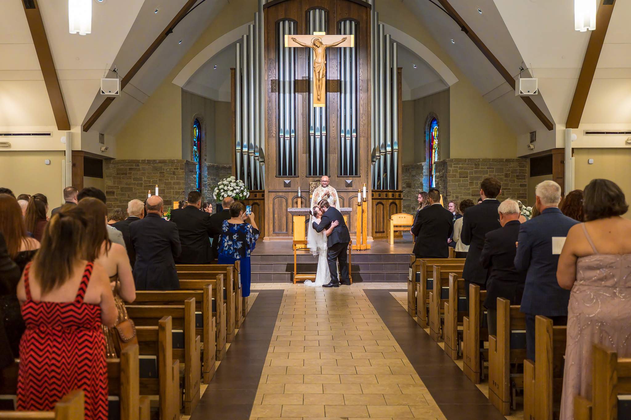 Guests watching an Atlanta church wedding ceremony from the pews