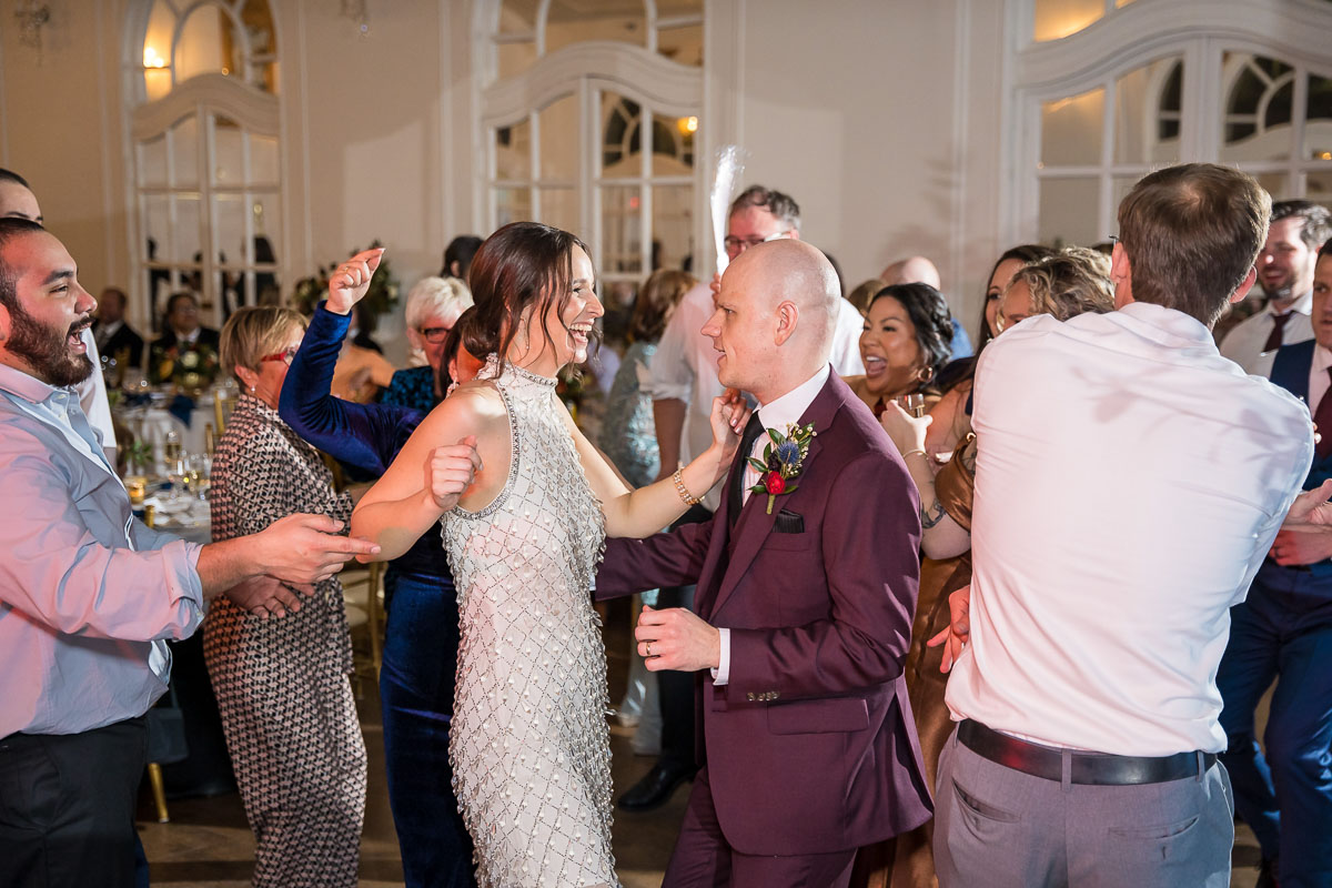 candid wedding photography couple dancing at reception