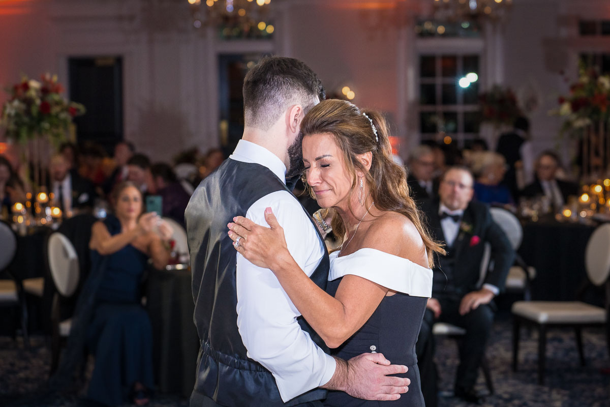 candid wedding photography mother son dance