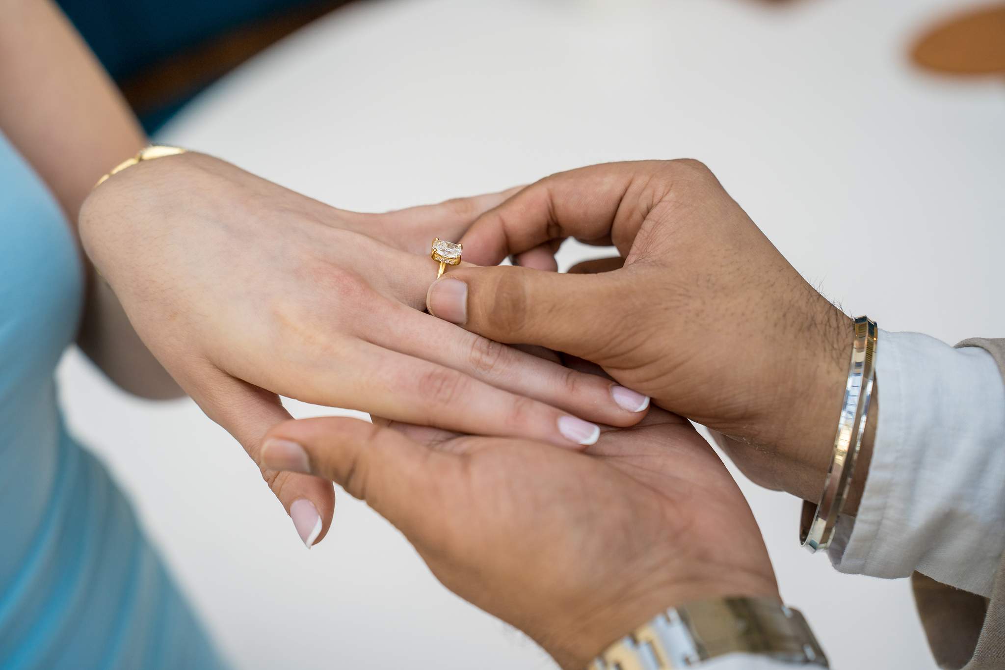 Close-up of the new engagement ring as he holds her hand at Chateau Elan