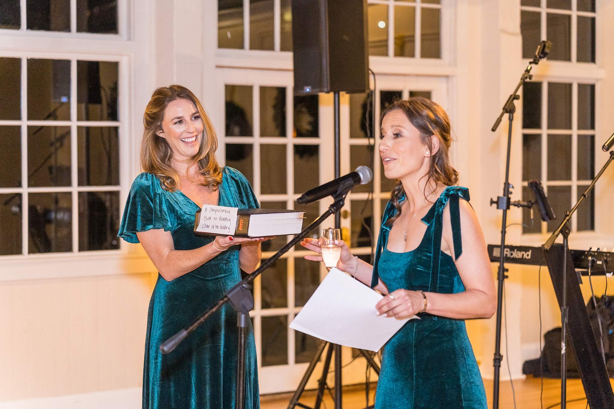Bridesmaids in green velvet giving a toast at a Christmas wedding