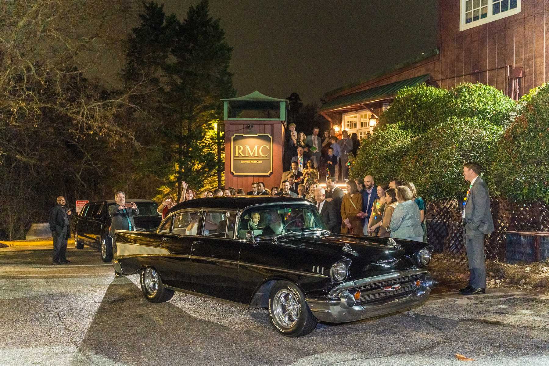 Vintage getaway car at night after a December wedding