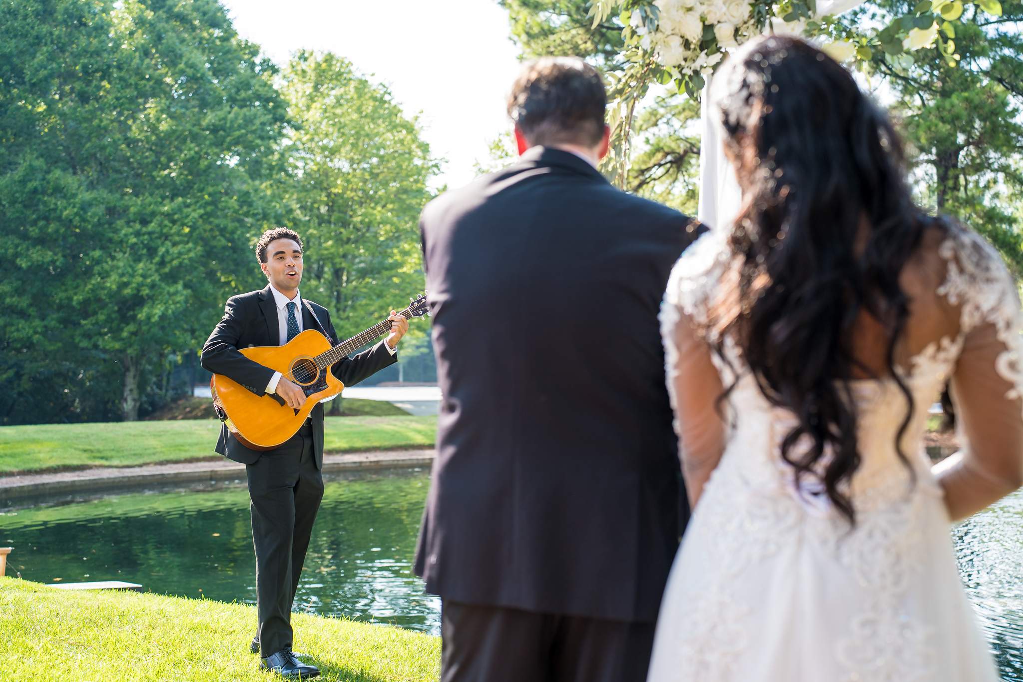Guitarist playing as the couple stands together at an Atlanta elopement