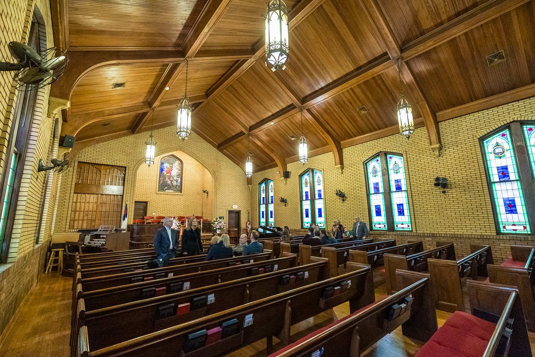 Side view of the pews and wood ceiling inside Fayetteville First United Methodist Church