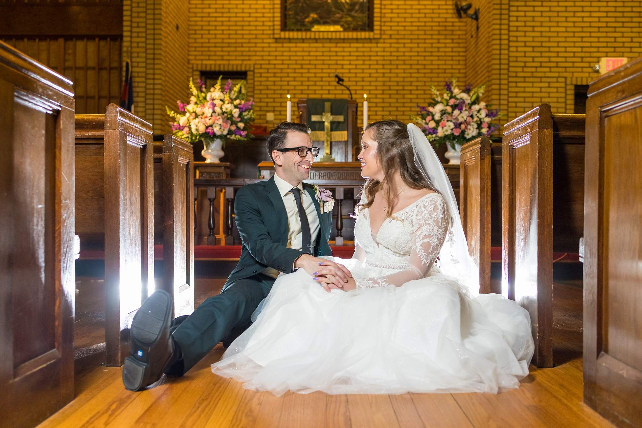 Couple seated together in a pew at Fayetteville First United Methodist Church