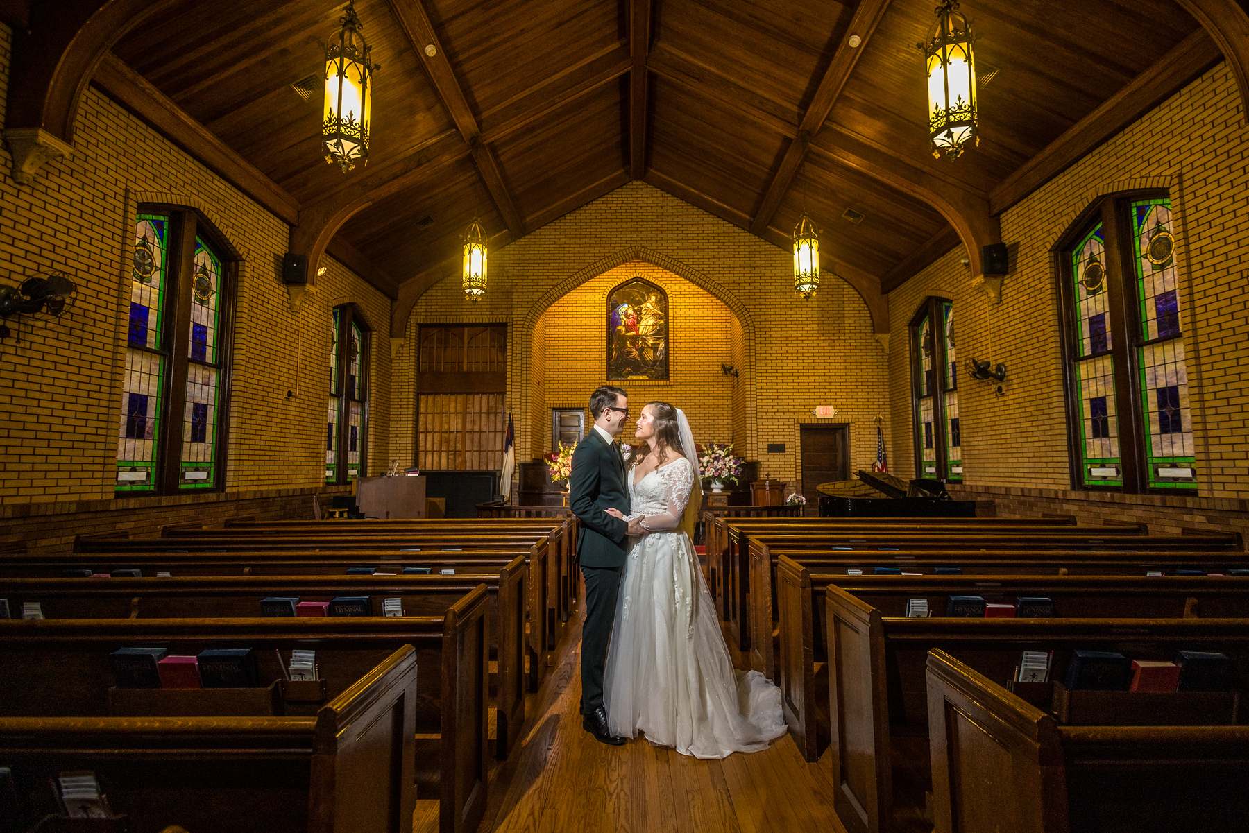 Couple in the center aisle of the sanctuary at Fayetteville First United Methodist Church