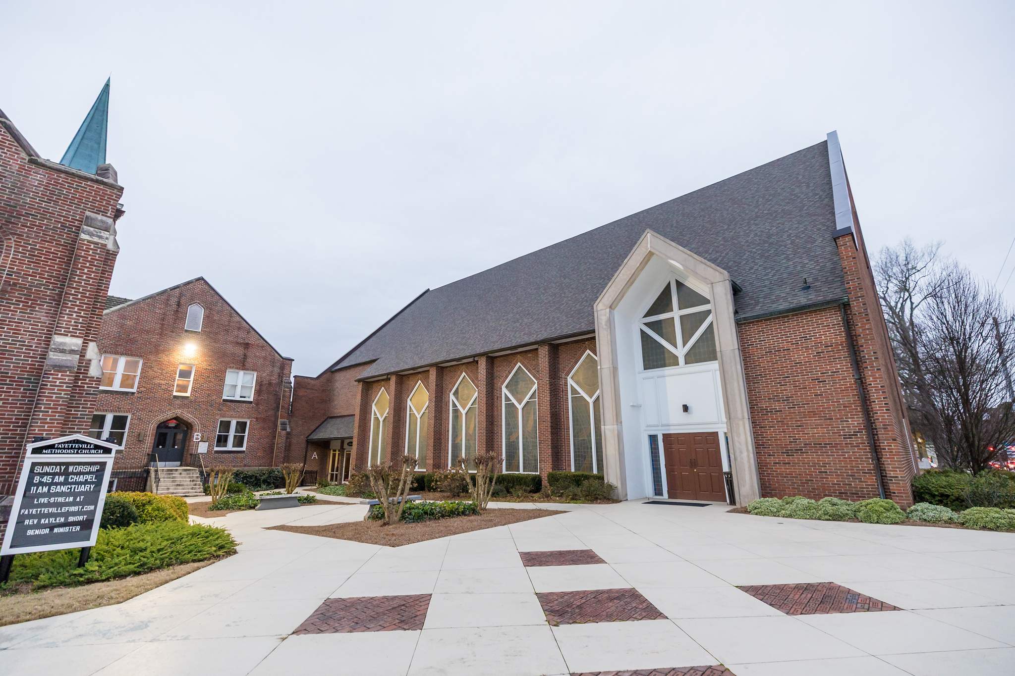 Brick exterior and steeple of Fayetteville First United Methodist Church in downtown Fayetteville