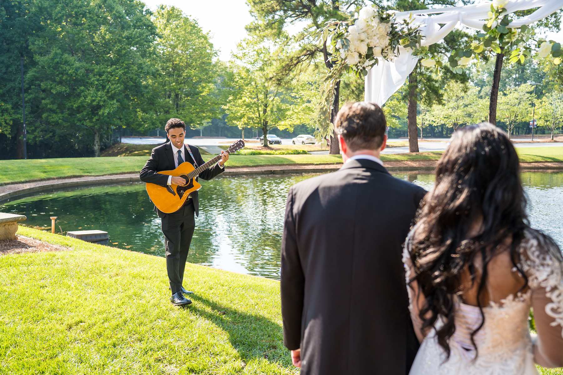 Guitarist playing during an outdoor ceremony at First Baptist Atlanta