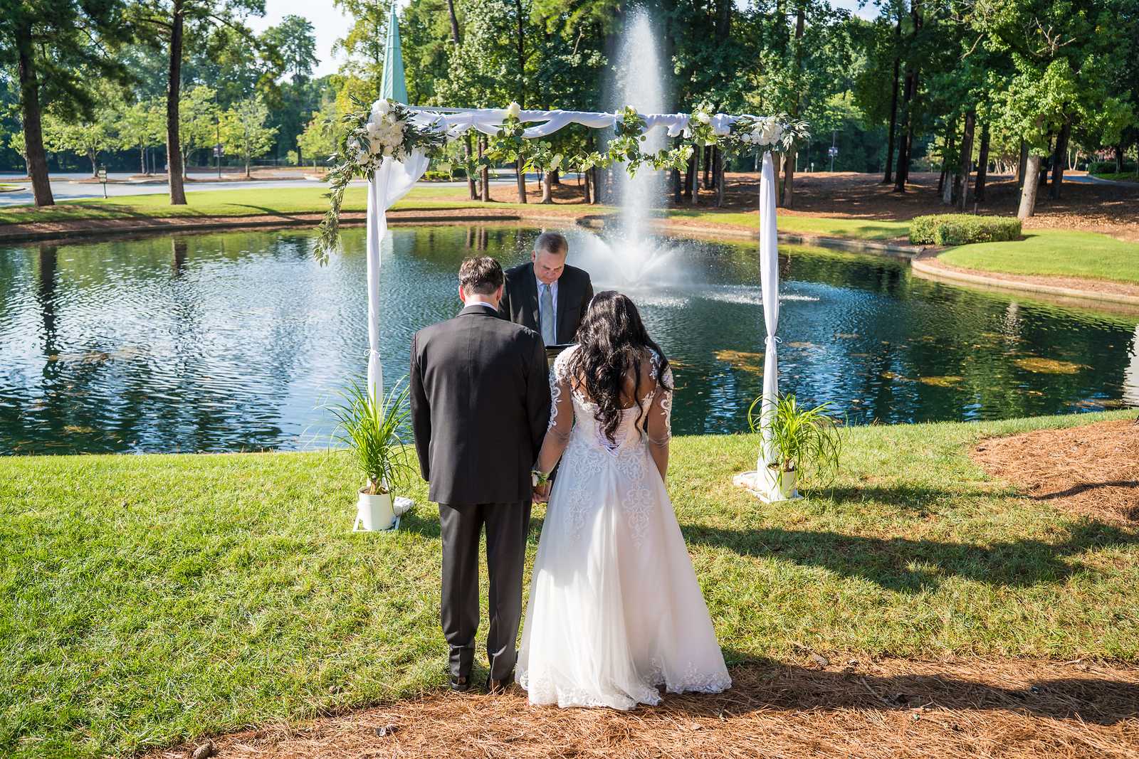 Couple standing together at the end of their outdoor ceremony at First Baptist Atlanta