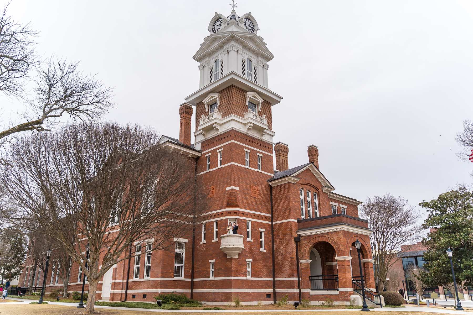 Red brick Gwinnett Historic Courthouse and clock tower in downtown Lawrenceville