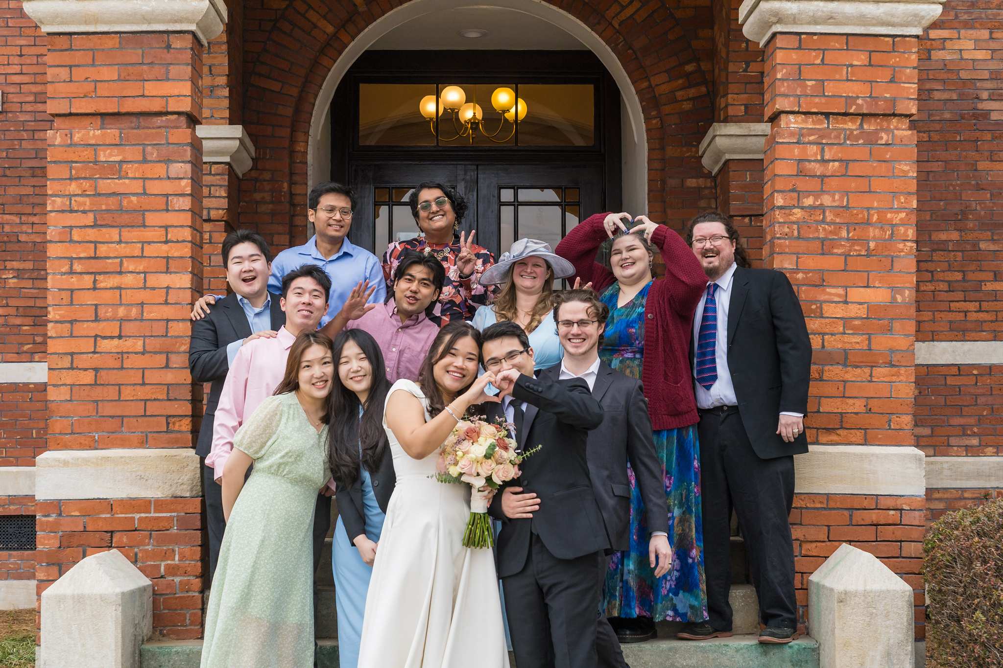 Wedding guests gathered on the steps of the Gwinnett Historic Courthouse