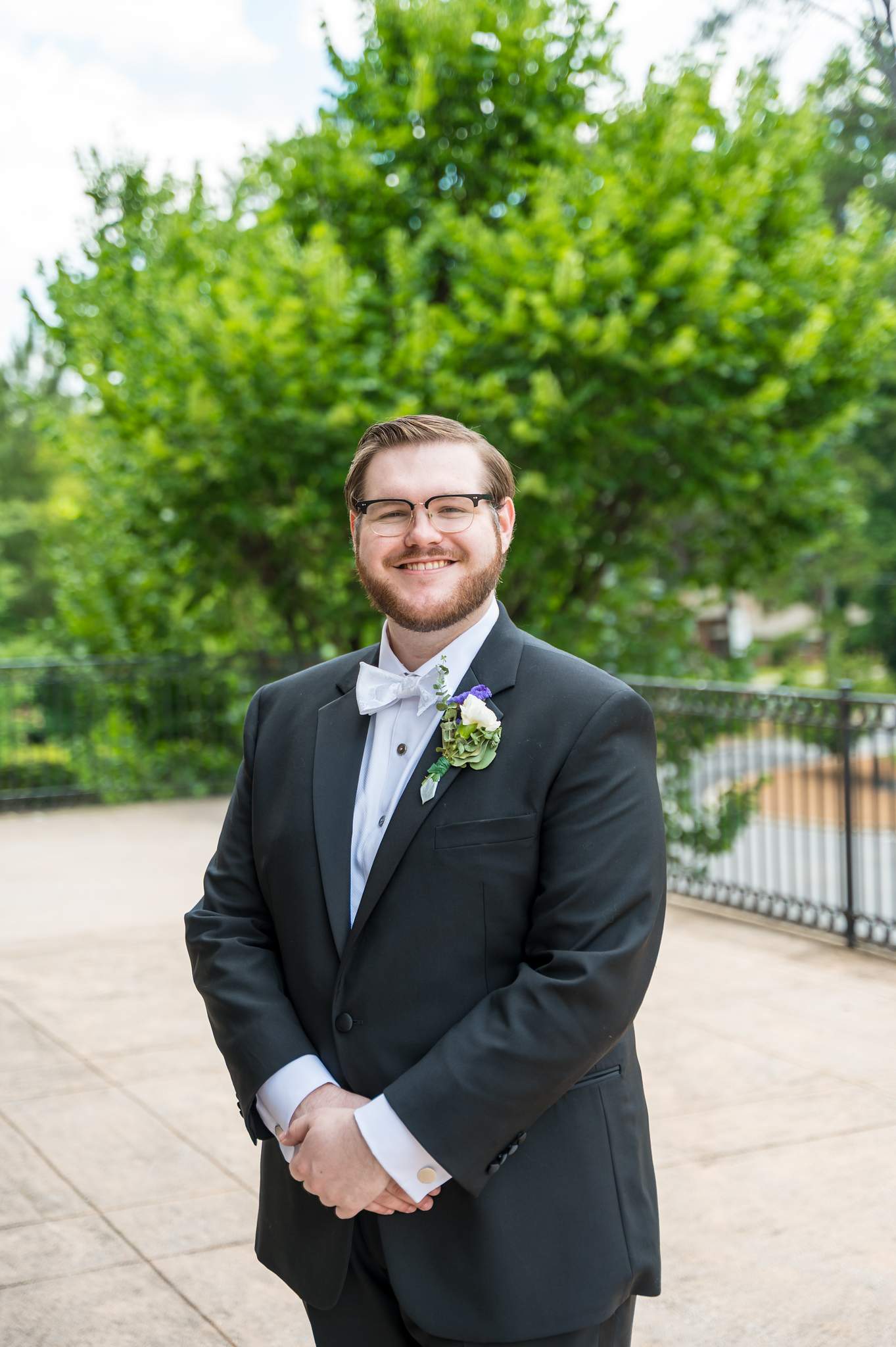 Groom portrait outside Immaculate Heart of Mary in Atlanta on the wedding day