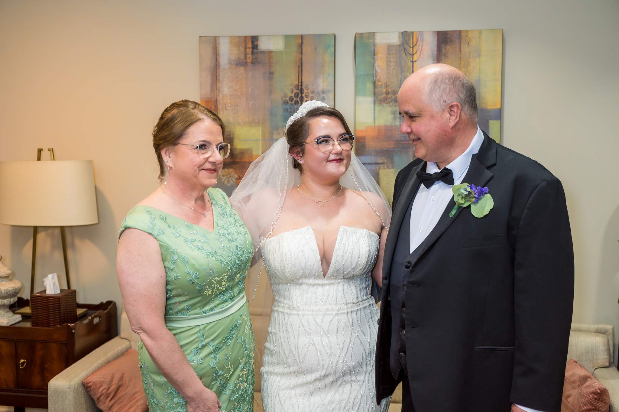 Bride sharing a moment with family while getting ready at Immaculate Heart of Mary