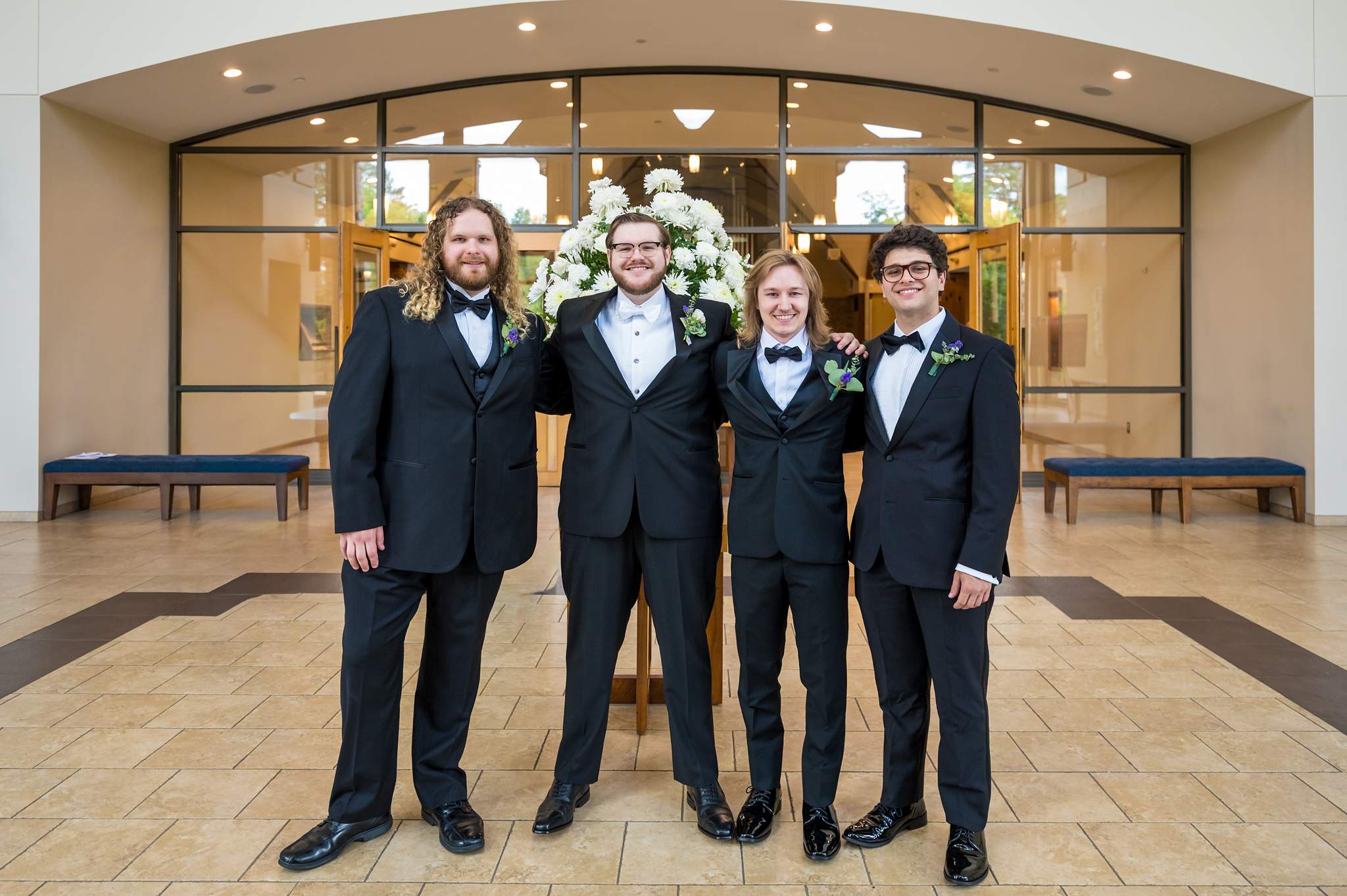 Groom with his groomsmen in the church lobby at Immaculate Heart of Mary