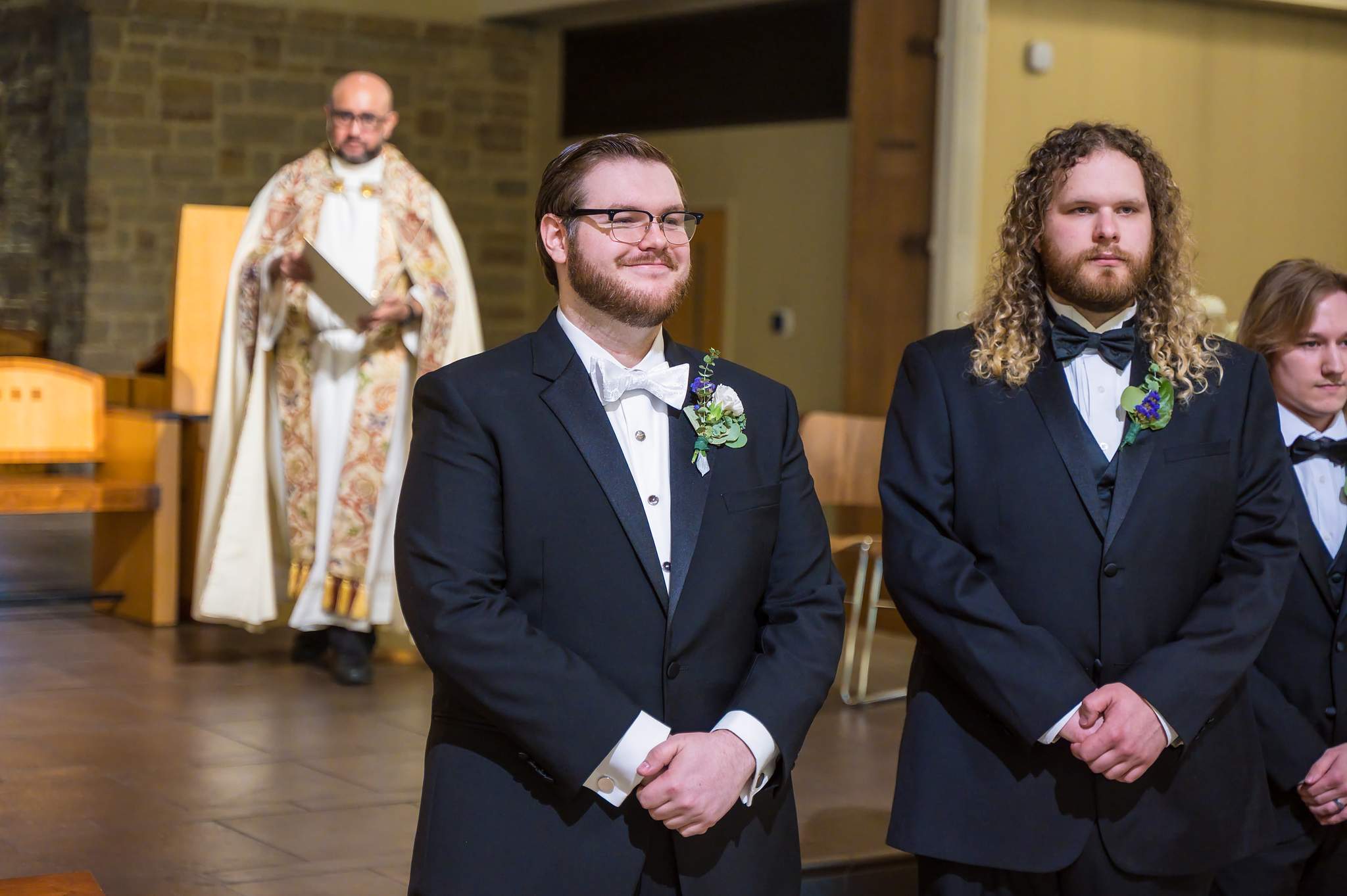 Groom waiting at the altar with the priest at Immaculate Heart of Mary