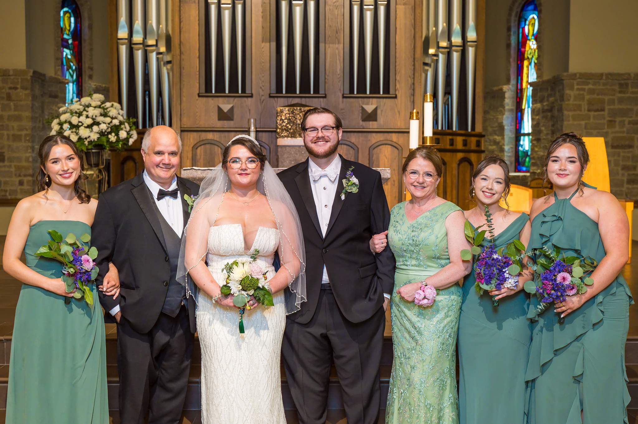 Wedding party portrait at the altar of Immaculate Heart of Mary in Atlanta