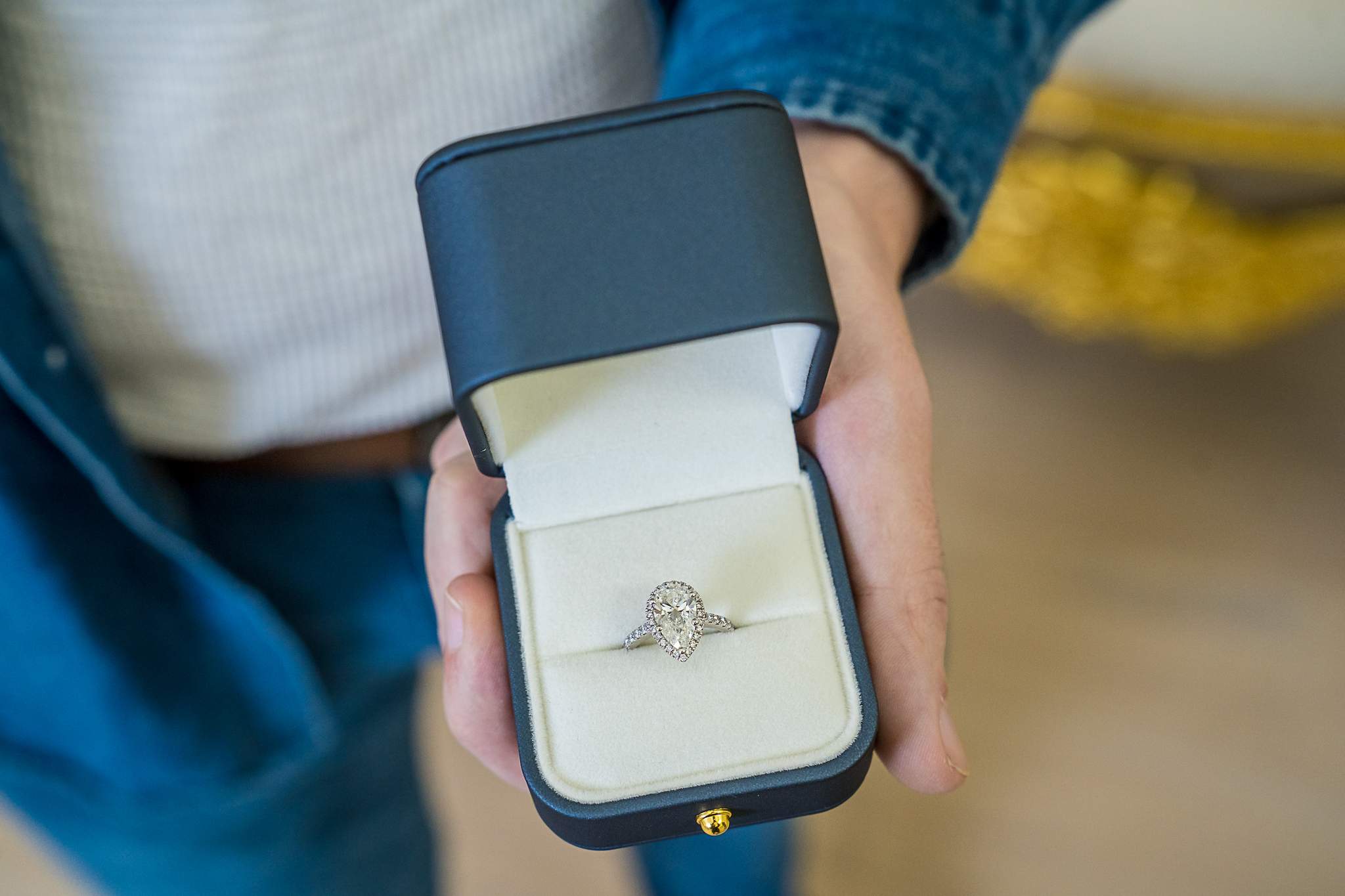Engagement ring in an open ring box during an indoor proposal session in Atlanta