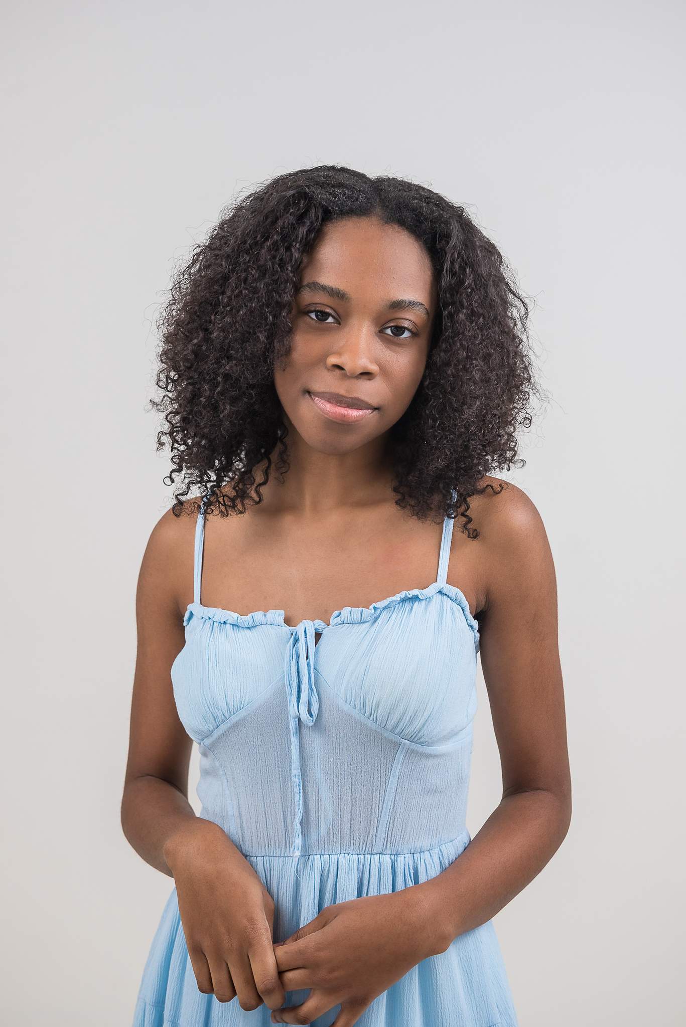 Woman in a light blue sundress at White Wall Studio Woodstock
