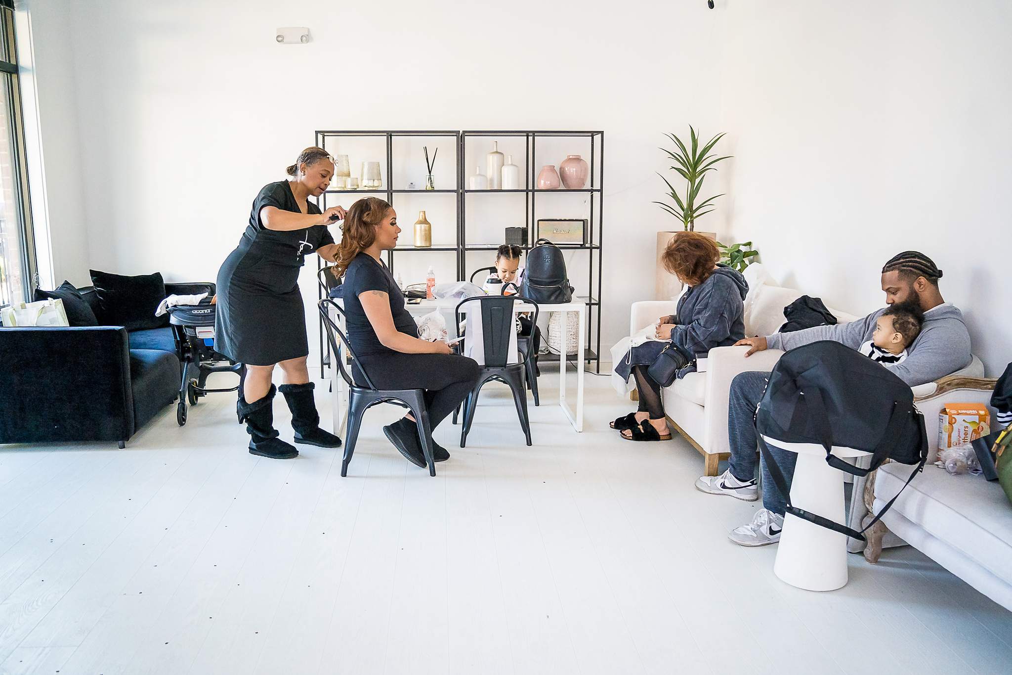 Wide view of the White Wall Studio lounge with hair and makeup in progress