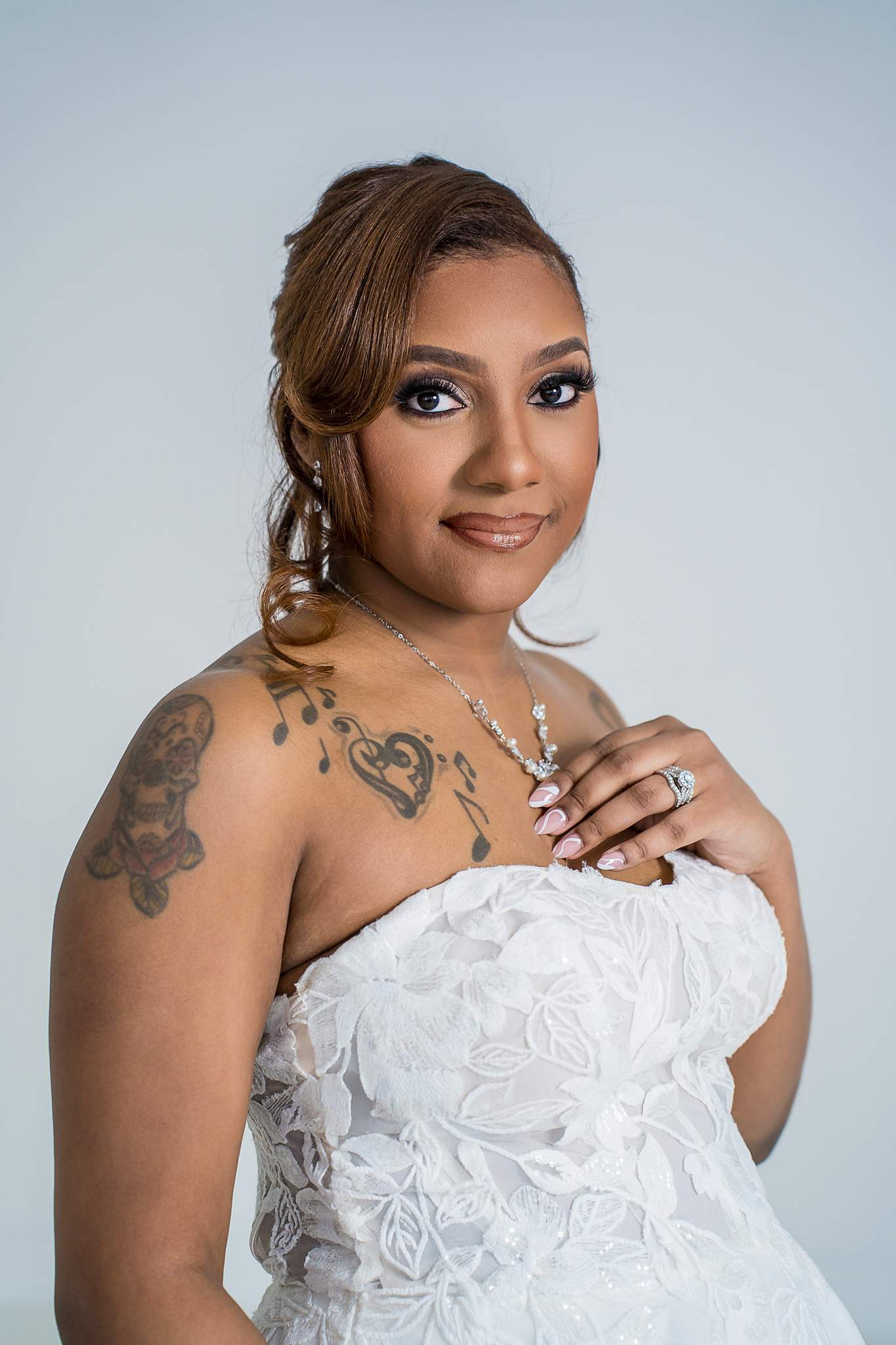 Woman in a strapless lace gown at White Wall Studio Woodstock