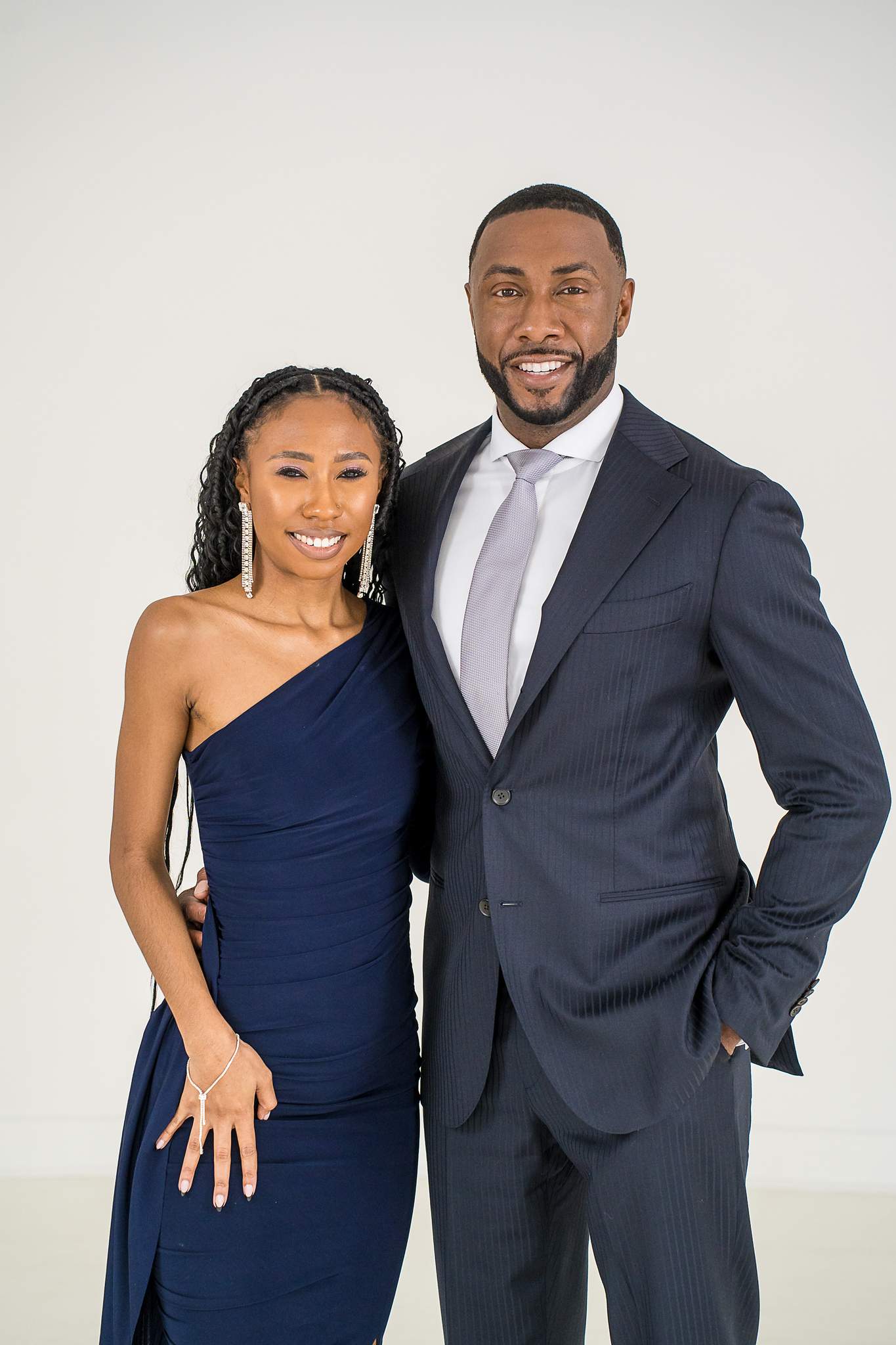 Family members in navy formal wear at White Wall Studio