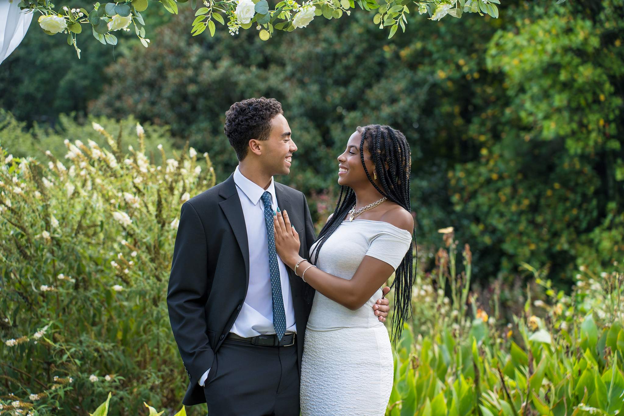 Interracial couple smiling together in a garden in Atlanta