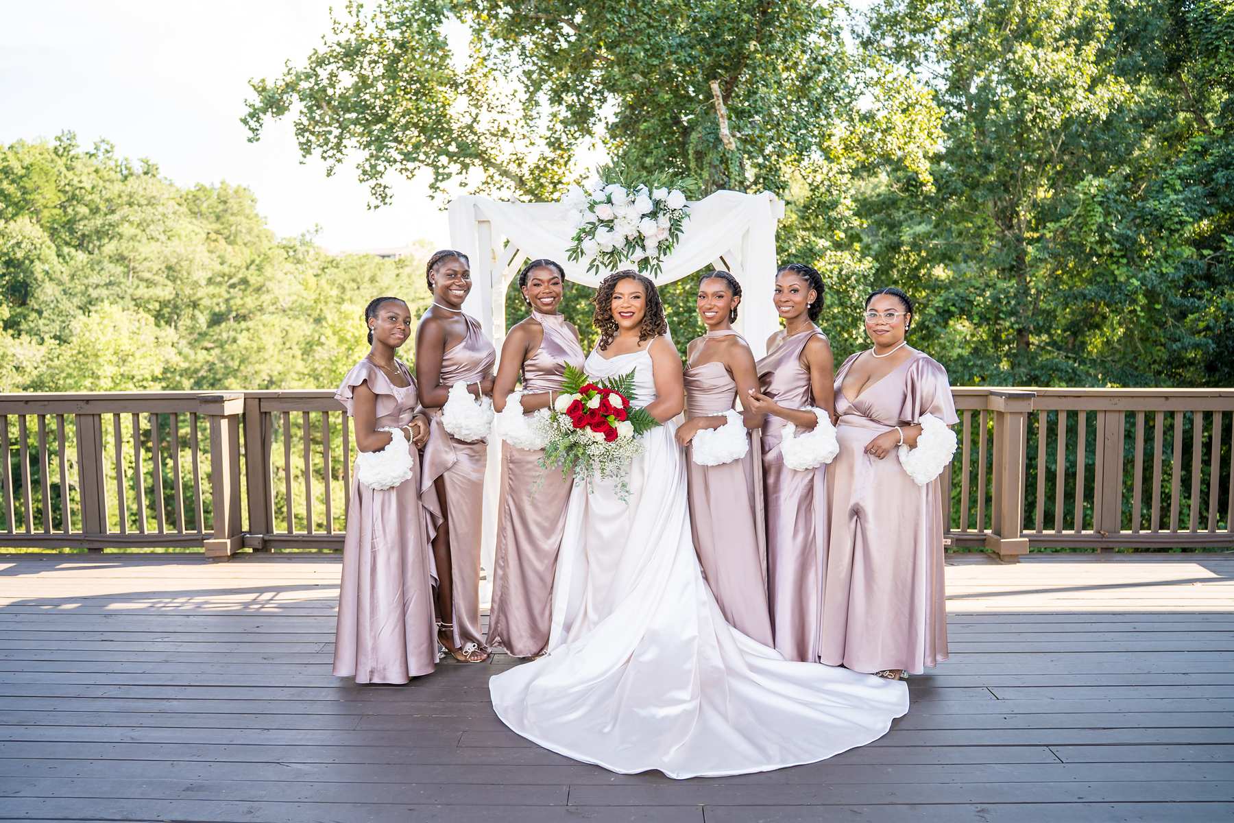 Bride with her bridesmaids on the deck at Ivy Hall at Roswell Mill