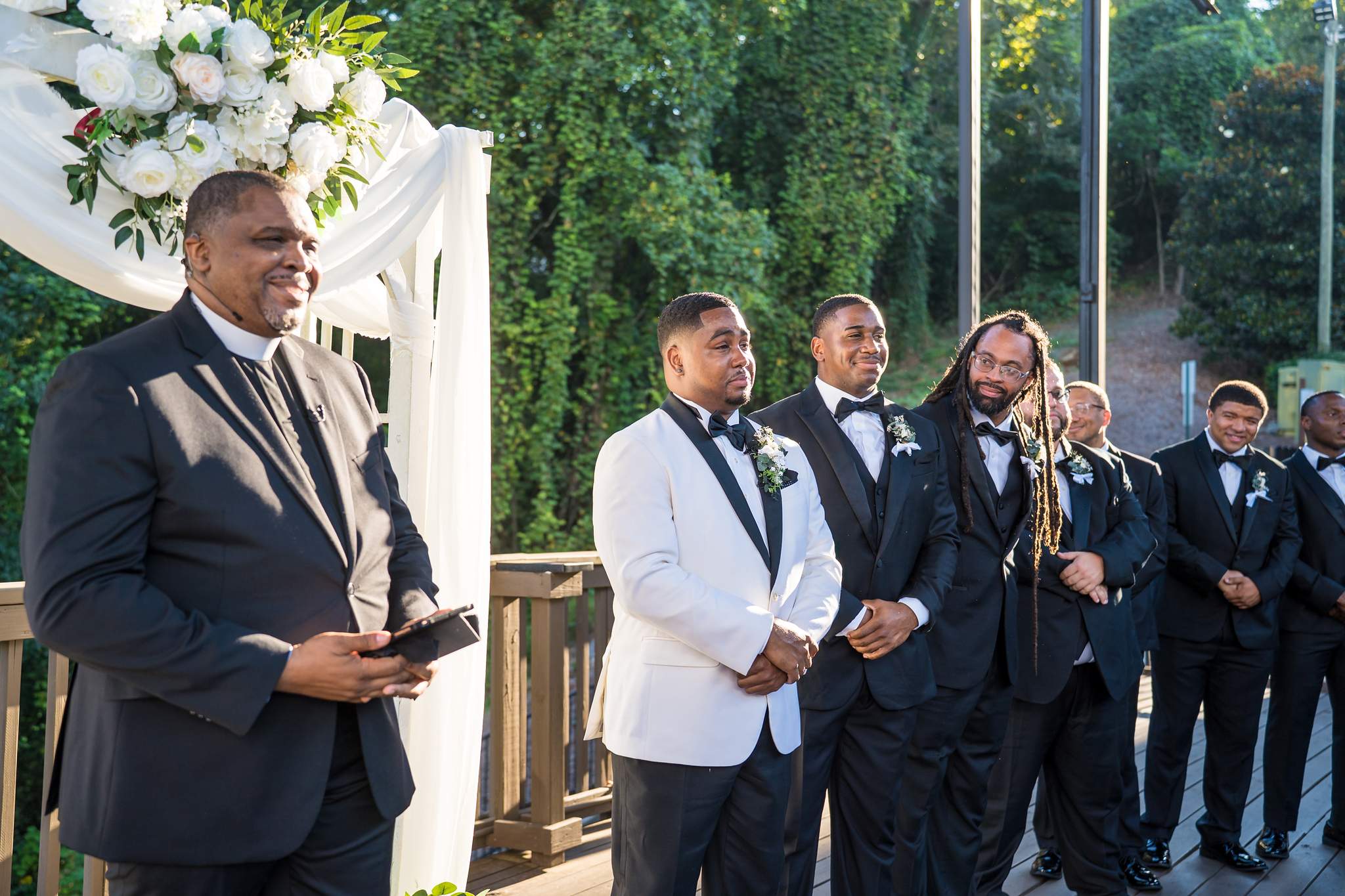 Groom watching the bride walk down the aisle at Ivy Hall at Roswell Mill