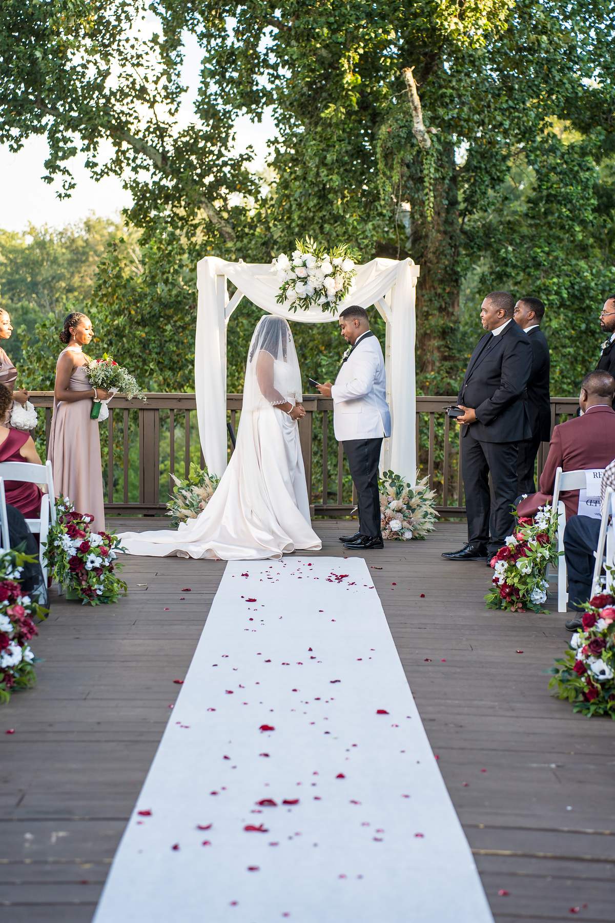 Bride and her escort arriving at the arbor during an Ivy Hall at Roswell Mill ceremony