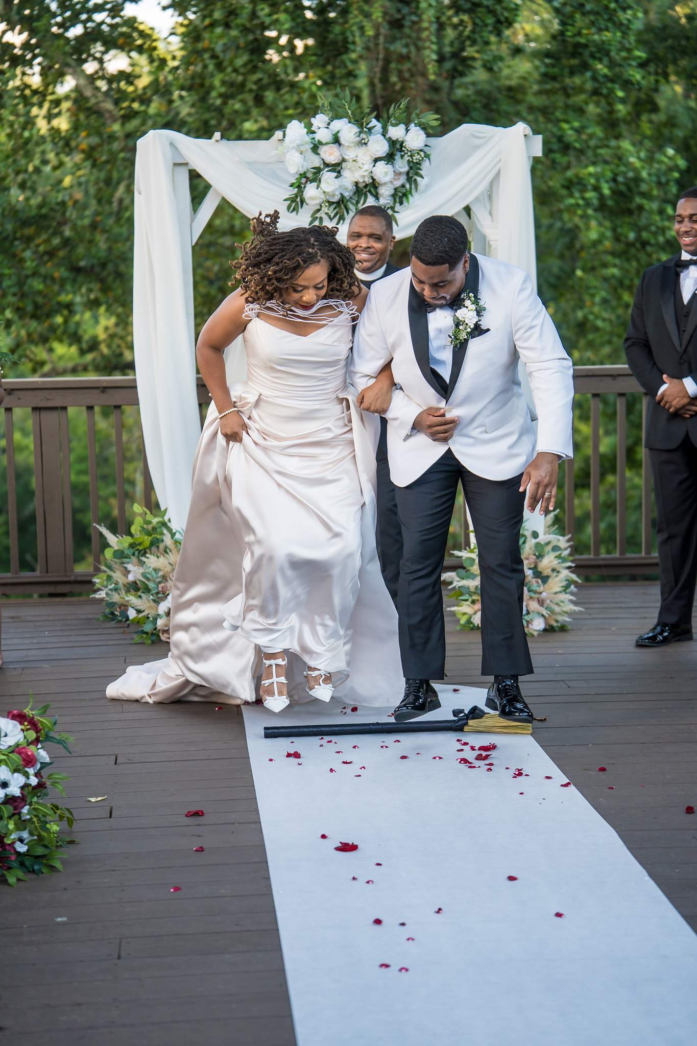 Couple celebrating as they walk back up the aisle at Ivy Hall at Roswell Mill