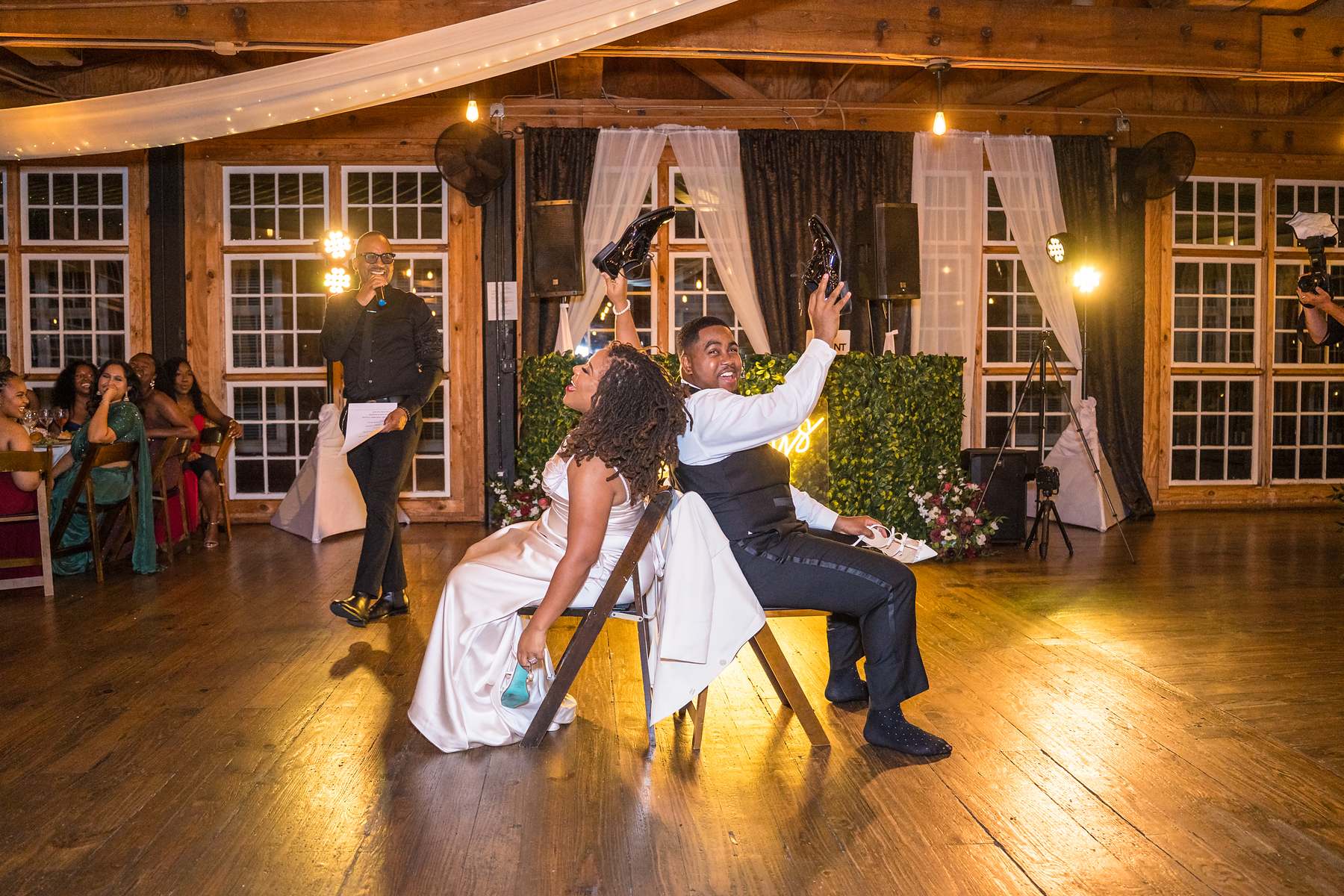 Garter toss at an Ivy Hall at Roswell Mill wedding reception