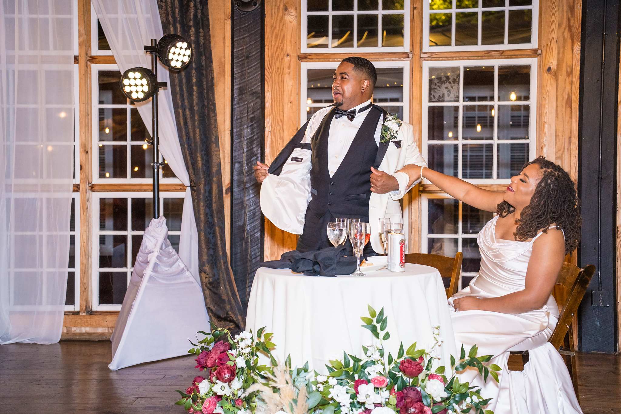 Couple at their sweetheart table at an Ivy Hall at Roswell Mill reception